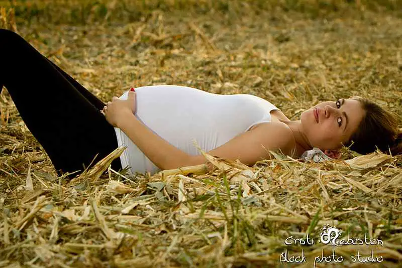 pregnant lying on the field