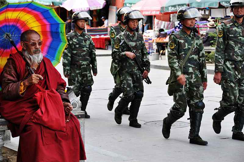 31-chinese-with-a-colorful-umbrella-while-soldiers-are-passing